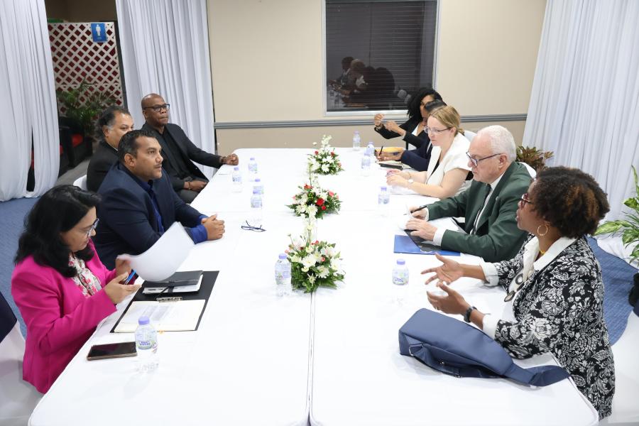 Officials from the Ministry engage in a bilateral discussion with the UN team after the signing ceremony.