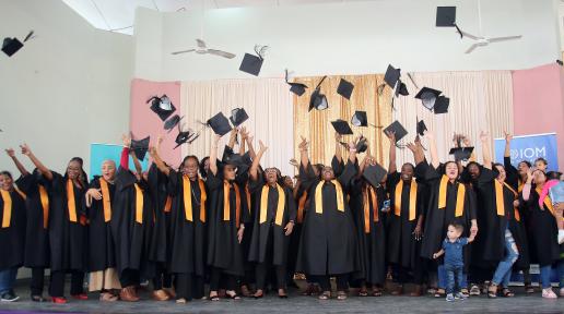 ASMA graduates toss their caps in the air